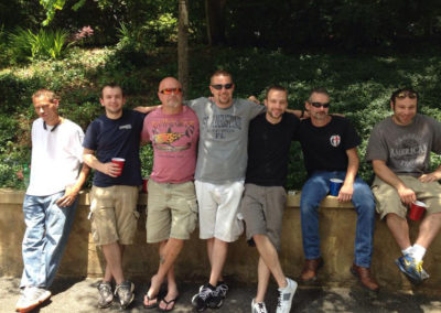 Group of Men posing for a photo at an Isaiah House outing